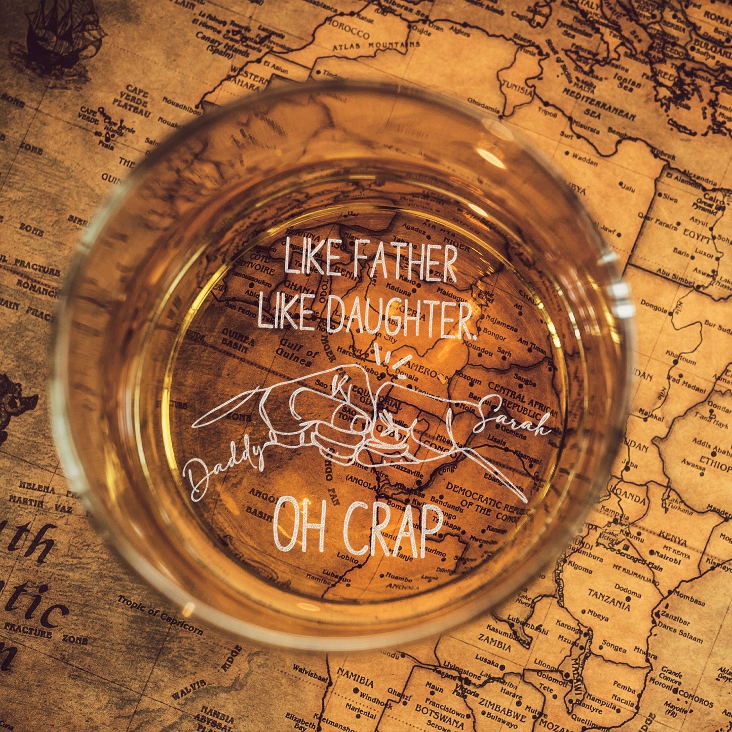 Custom whiskey glass etched with 'Like Father Like Daughter' and personalized artwork.