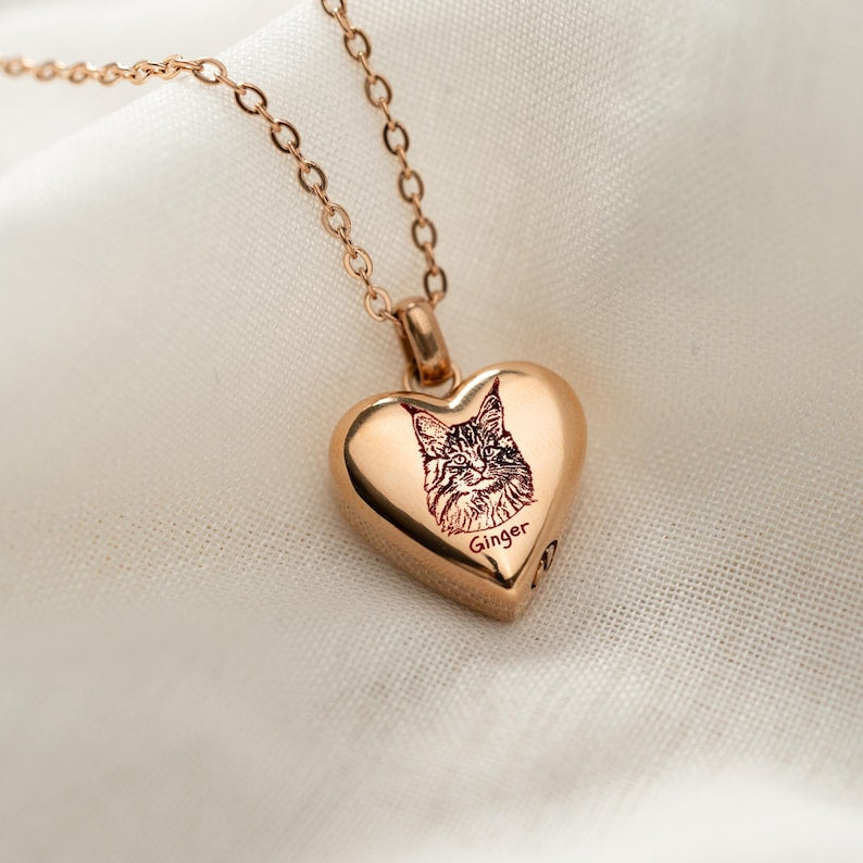 A thoughtful sympathy gift, this Personalized Cat Photo Heart Urn Necklace is a beautiful personalized memorial necklace.