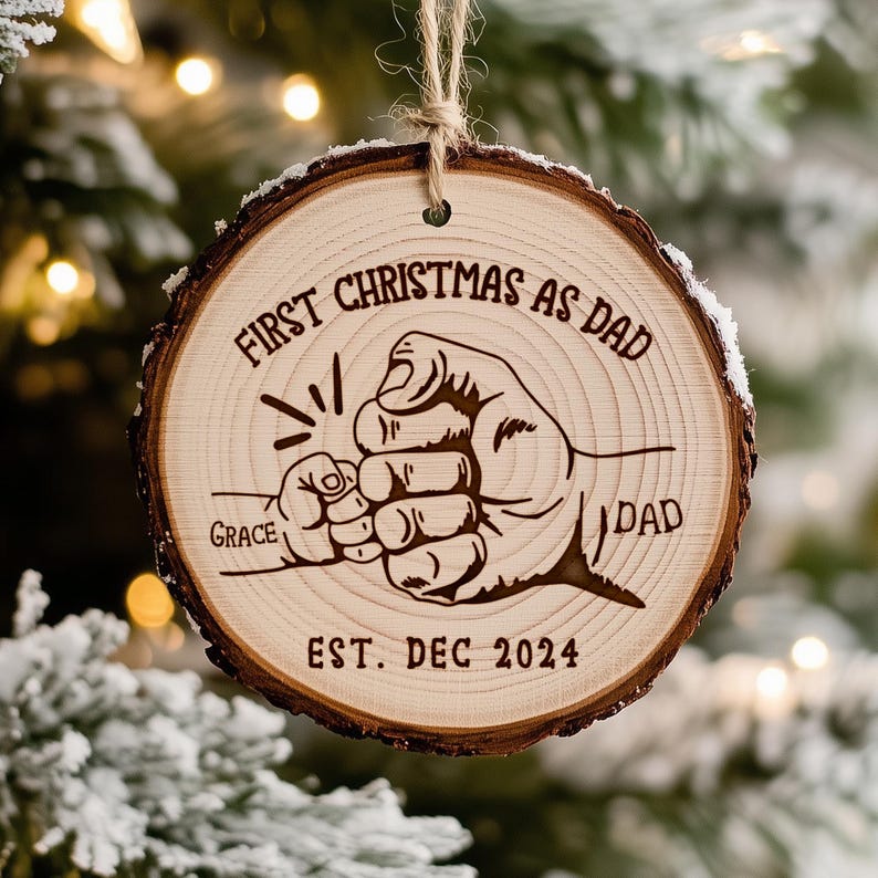 A custom personalized wooden ornament marking a 'First Christmas As Dad', one of the best gifts for new dads this holiday season.