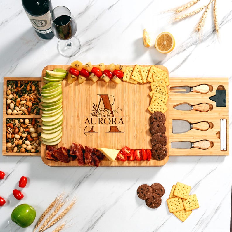 The perfect wedding gift: a Personalized Monogrammed Bamboo Charcuterie Board with a full set of serving tools.