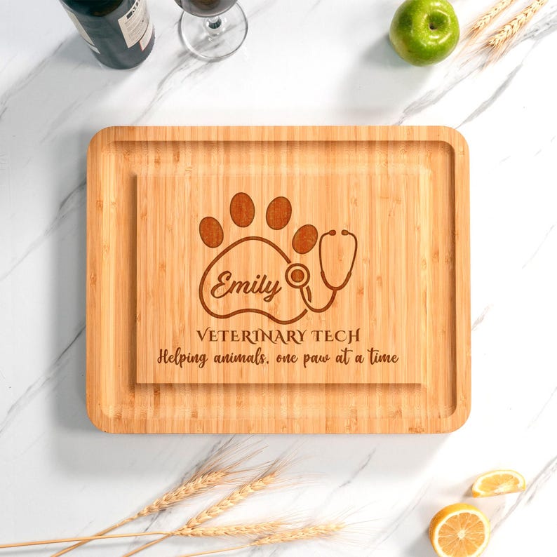 A custom-made Personalized Veterinary Tech Bamboo Charcuterie Board, a unique gift idea for a new veterinarian or vet nurse.