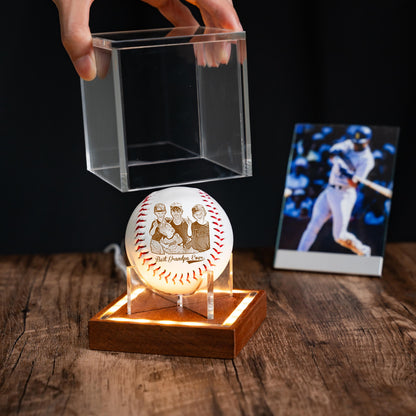 Baseball in a clear display case on a wooden surface with a dark background