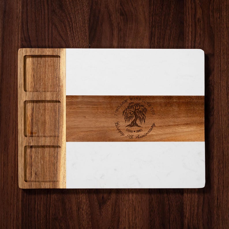 A custom cheese board made of marble, celebrating a 9-year anniversary with personalized engraving.