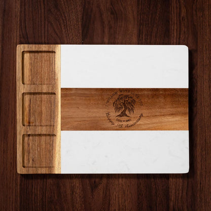 A custom cheese board made of marble, celebrating a 9-year anniversary with personalized engraving.