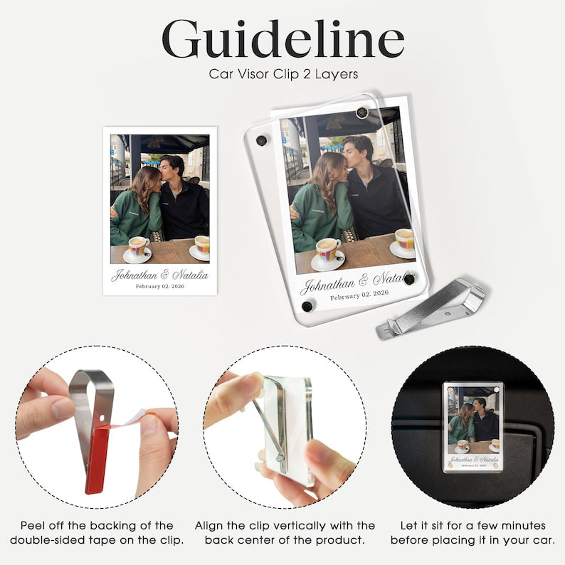 A close-up of an anime-style custom couple Pokemon card visor clip for unique car accessories gifts.