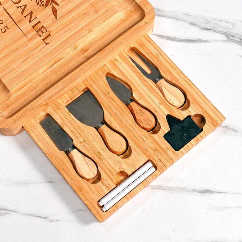The ideal gift for newlyweds, a Personalized Bamboo Wedding Charcuterie Board with Tools, complete with an engraved cheese board and knives.