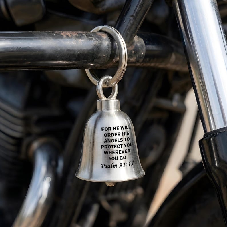 Custom engraved motorcycle guardian bell featuring a cross wing bell design and a sacred Bible verse.