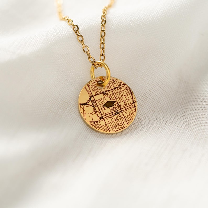 This custom engraved necklace features a college map, making it a perfect graduation gift for her.