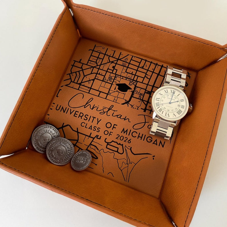 This custom leather valet tray features a college map, making it a perfect graduation gift.