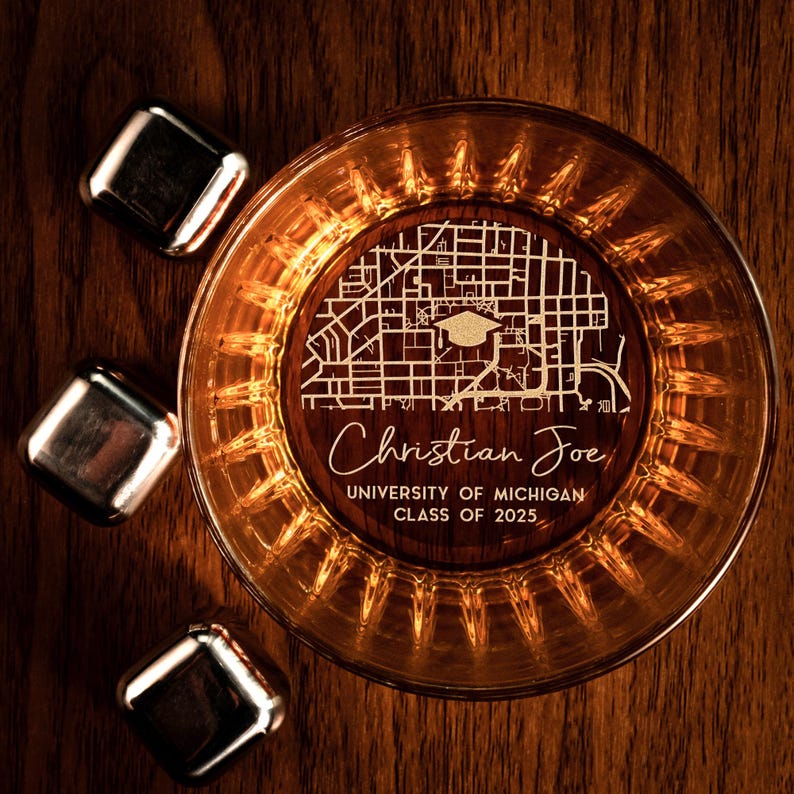A high-quality bottom engraved whiskey glass showcasing your alma mater, ideal for personalized whiskey glassware.