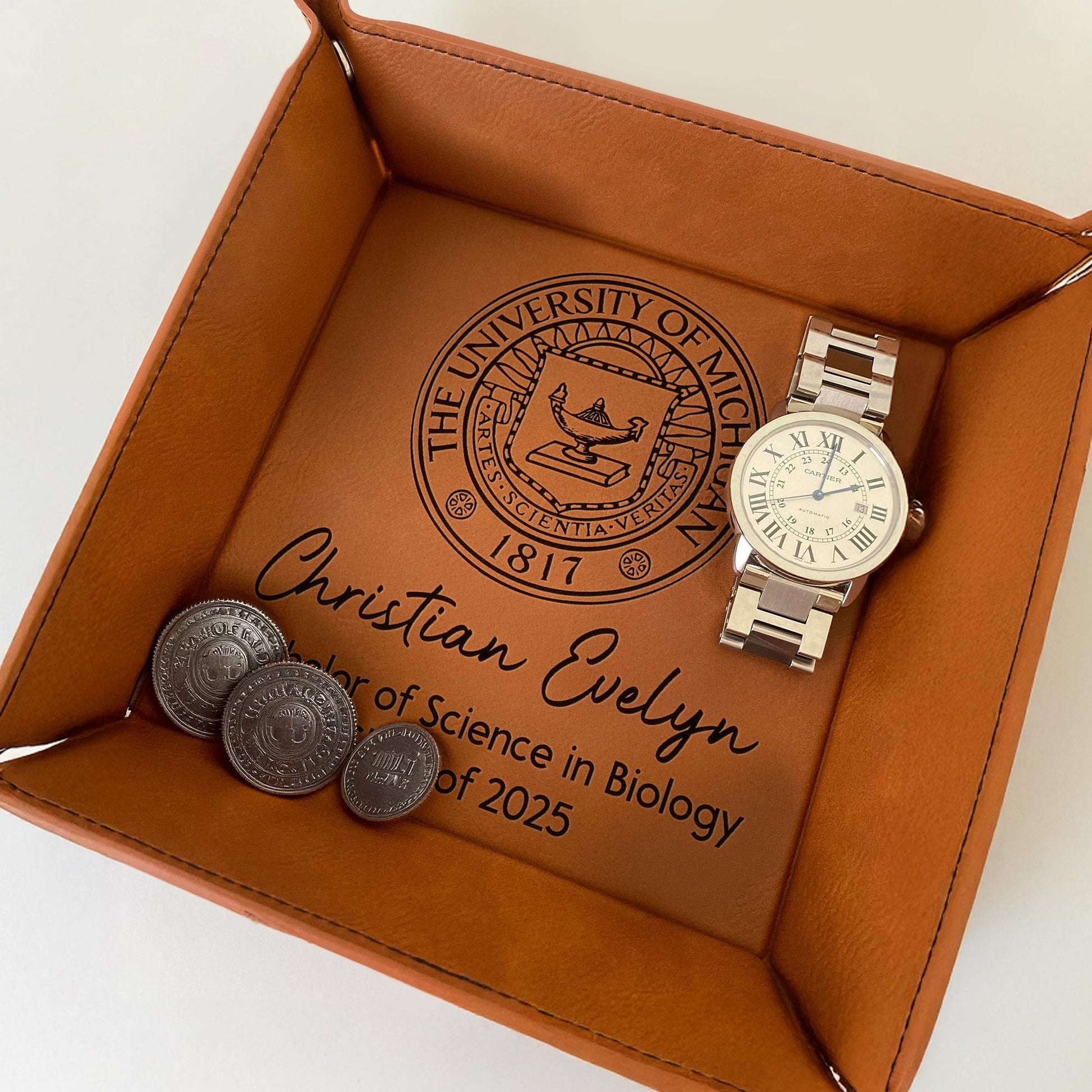 Graduation gifts for him include personalized keepsakes to honor his college journey  