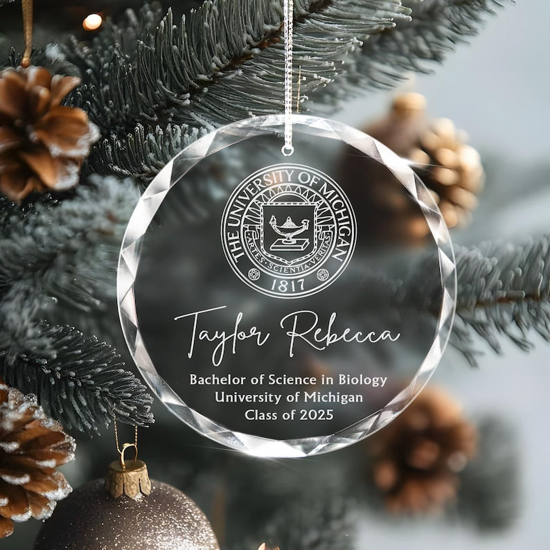 A close-up of a sparkling crystal Personalized College Logo Graduation Glass Ornament, a thoughtful gift for any graduate.