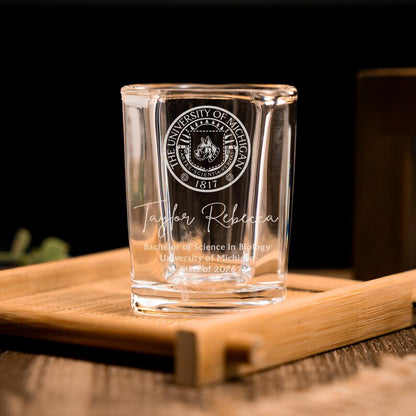 This custom shot glass features a university logo, making it a perfect college graduation gift.