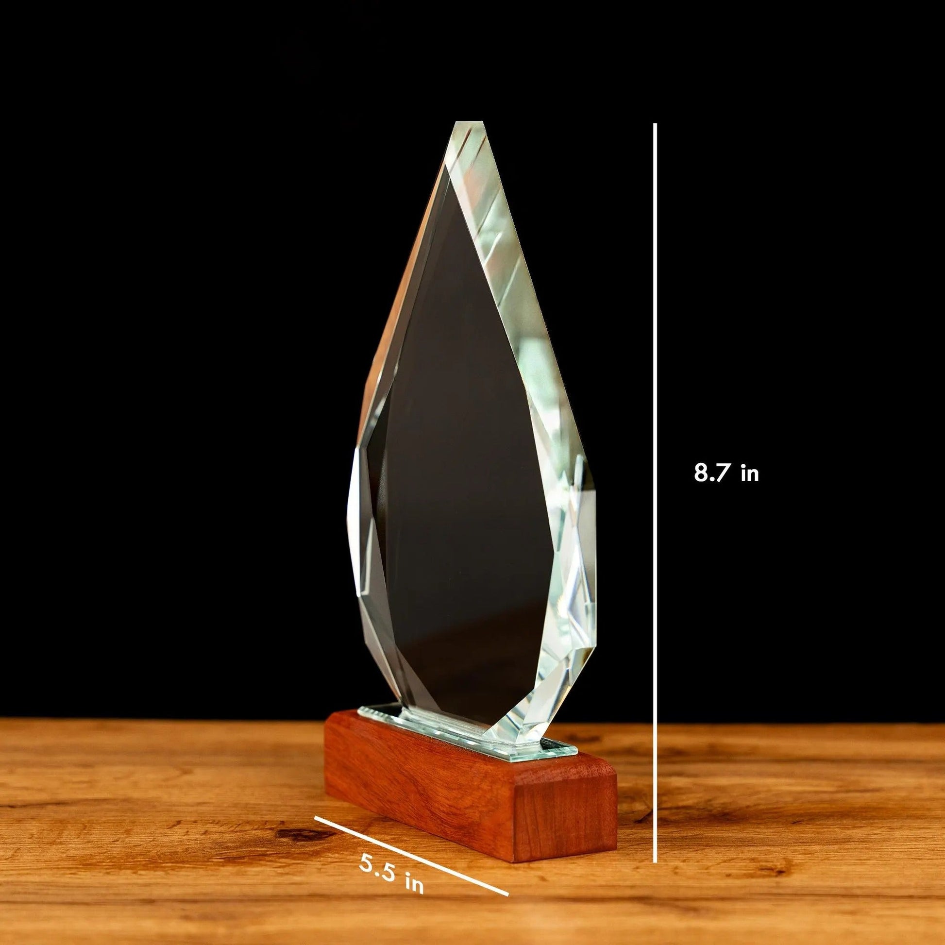 Bulk personalized gifts with company logo presented as elegant corporate crystal awards  