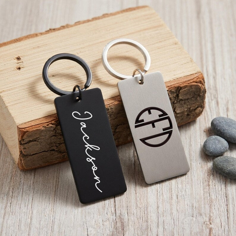 Custom metal keychains featuring a laser engraved keychain design, the perfect initial keychain for dad.