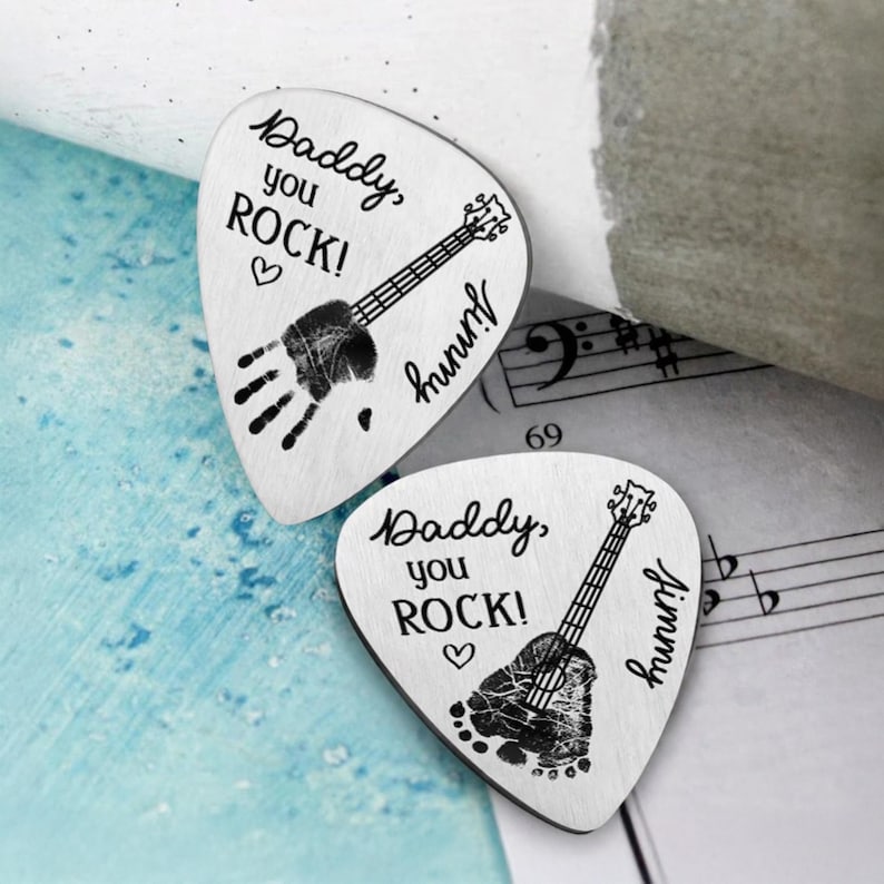 Customized guitar plectrum for expecting dads, perfect for the guitar player awaiting his first child.