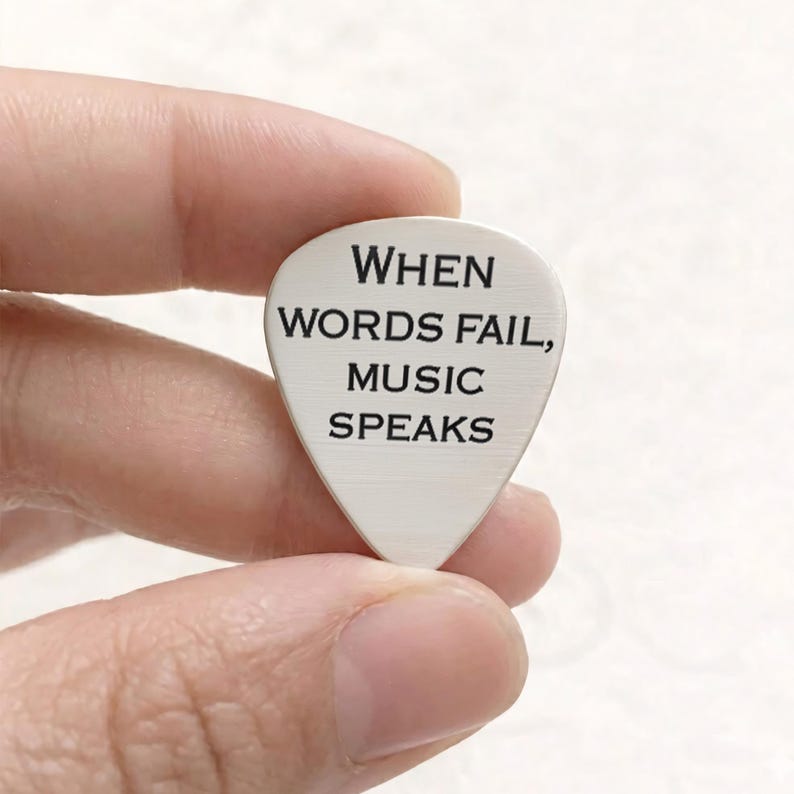 Durable engraved guitar plectrum, providing a unique music gift for dad.