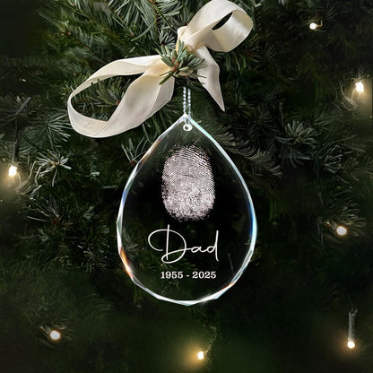 A Personalized Fingerprint Dad Remembrance Teardrop Glass Ornament, a touching sympathy gift for the loss of a father.