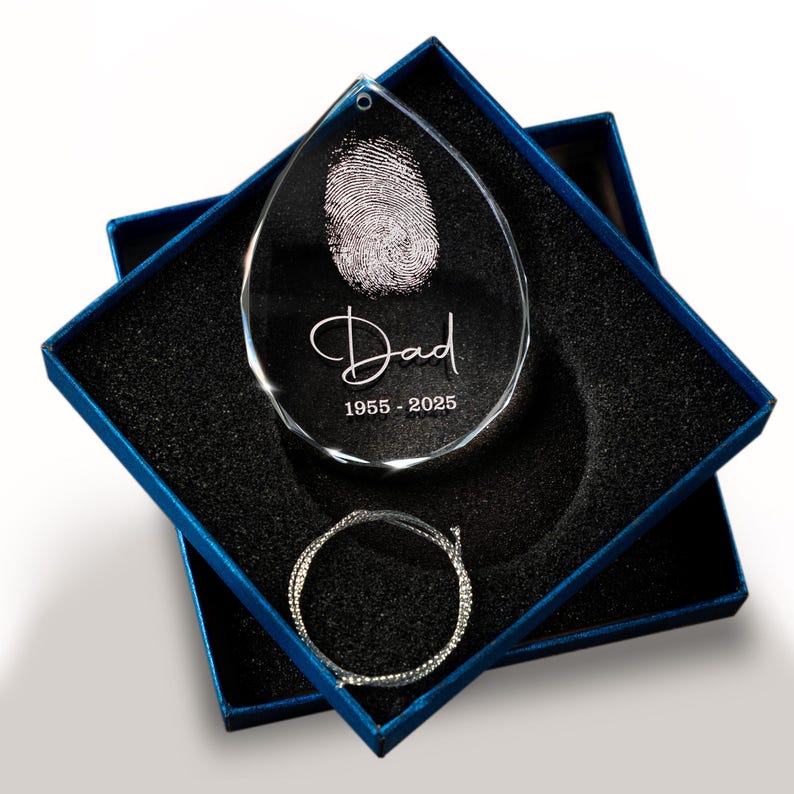 This engraved Christmas ornament, a Personalized Fingerprint Dad Remembrance Teardrop Glass Ornament, is a beautiful memorial fingerprint ornament.