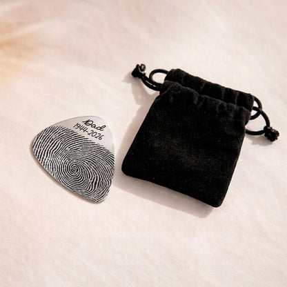 This custom guitar pick features a unique thumbprint, making it a special Father's Day gift for dad.