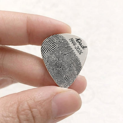 Unique thumbprint guitar pick, offering a heartfelt and personalized way to honor a cherished memory.