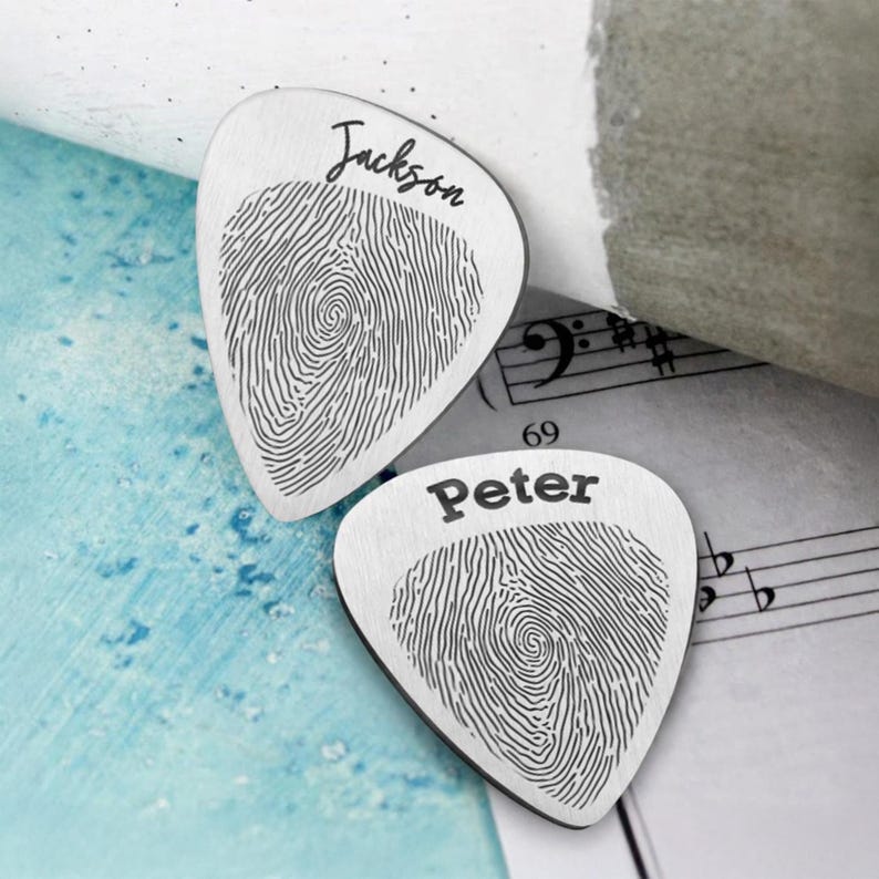 Customized guitar plectrum with a fingerprint, perfect for a dad who plays or collects picks.
