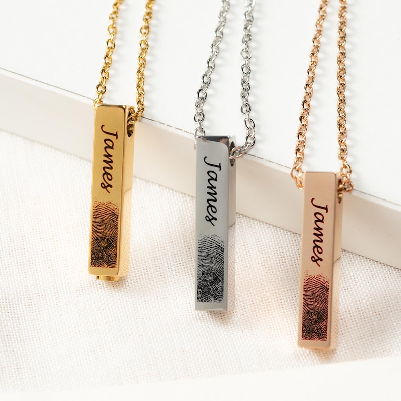 A close-up of the engraved Personalized Fingerprint Urn Bar Necklace, a thoughtful sympathy gift for loss of father.