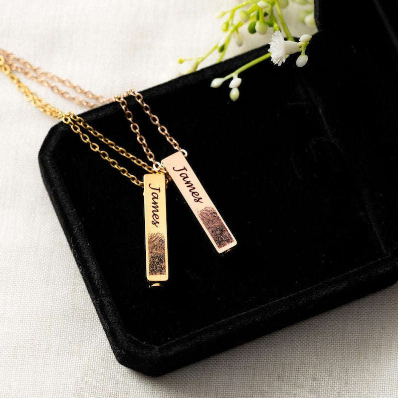 This personalized urn necklace, a Personalized Fingerprint Urn Bar Necklace, is a unique memorial fingerprint urn necklace.
