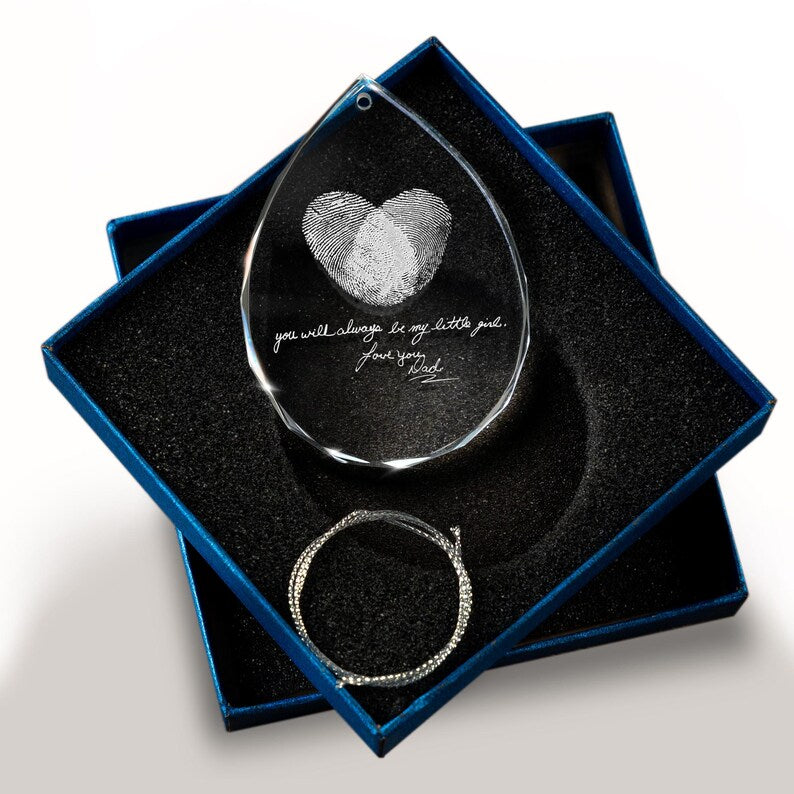 This teardrop ornament, a Personalized Memorial Teardrop Glass Ornament, is a beautiful memorial fingerprint ornament for remembrance.
