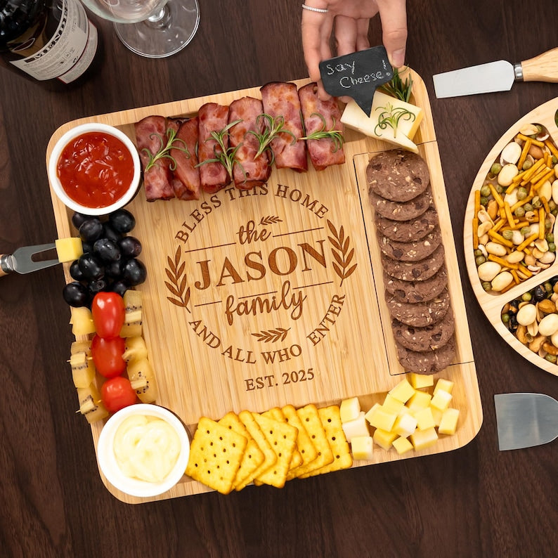 A custom personalized charcuterie board with tools, the Personalized Housewarming Bamboo Charcuterie Board is an excellent first home gift.
