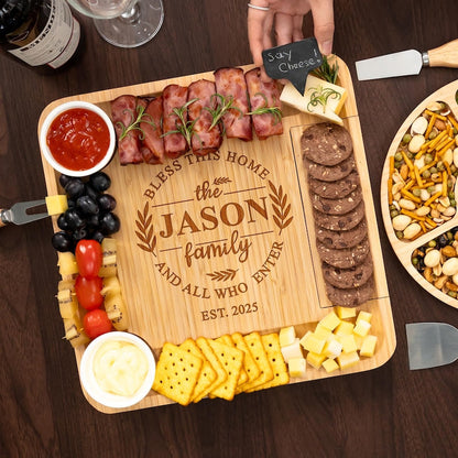 A custom personalized charcuterie board with tools, the Personalized Housewarming Bamboo Charcuterie Board is an excellent first home gift.
