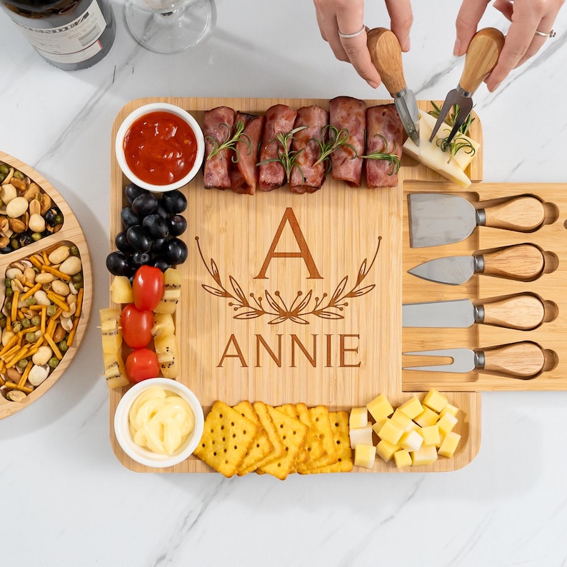 An engraved bamboo charcuterie board, the Personalized Housewarming Bamboo Charcuterie Board is a unique and memorable housewarming gift.
