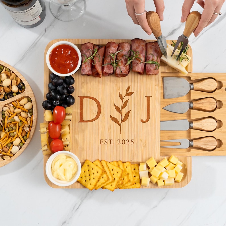 The ideal house warming gift, this Personalized Housewarming Bamboo Charcuterie Board is a beautiful personalized charcuterie board set.