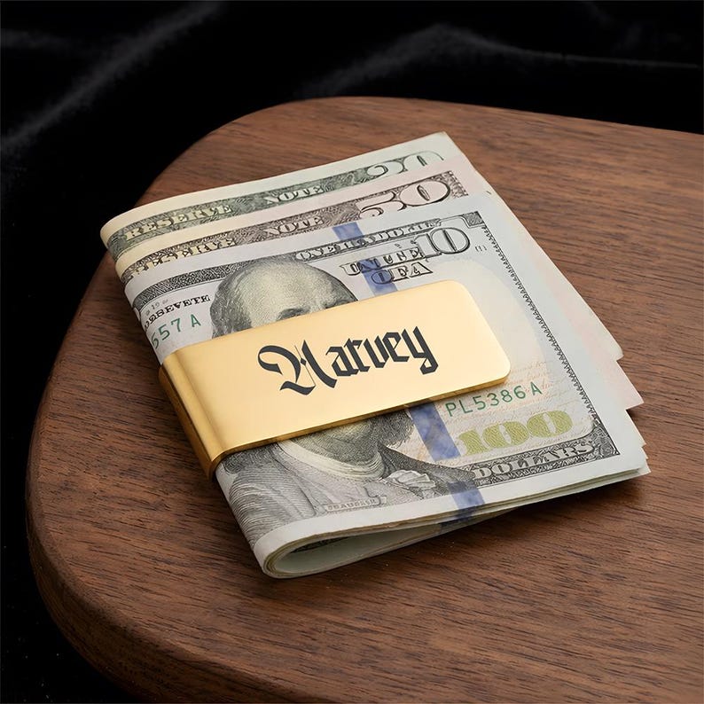 Custom stainless steel money clip engraved with initials, the best money clip for dad for Father's Day 2026.