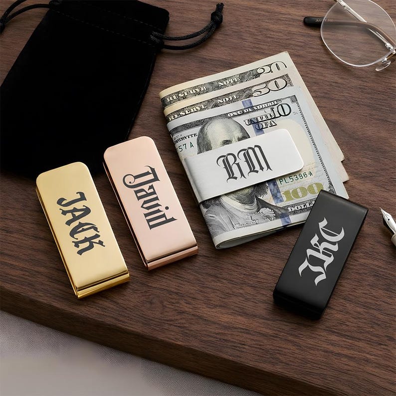 Stainless steel money clip engraved with a name initial, making it one of the best unique groomsmen gifts or custom groomsmen gifts.