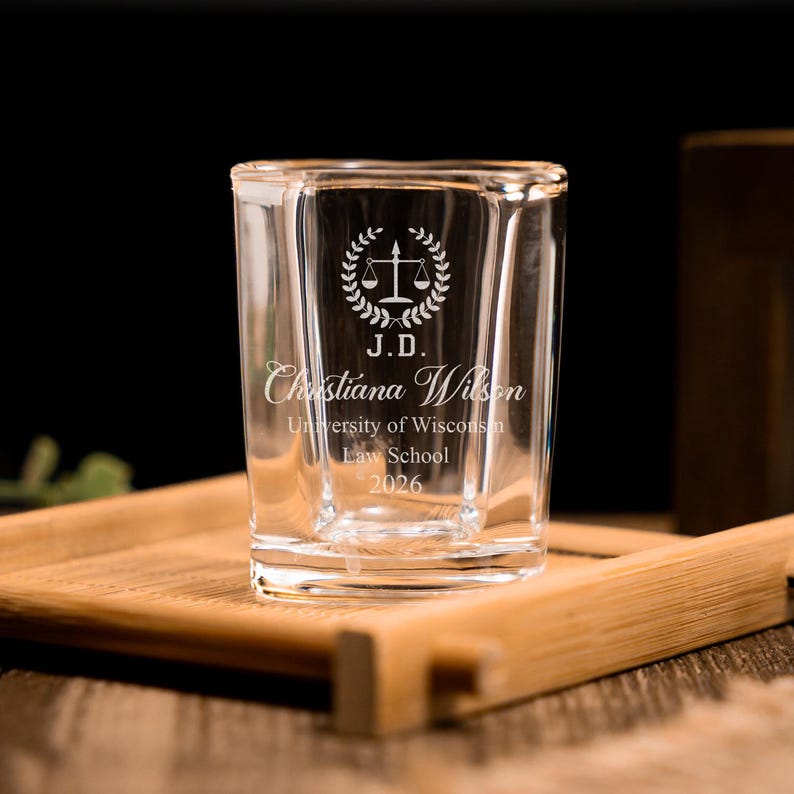 This custom shot glass features professional engraving, making it a perfect lawyer graduation gift.