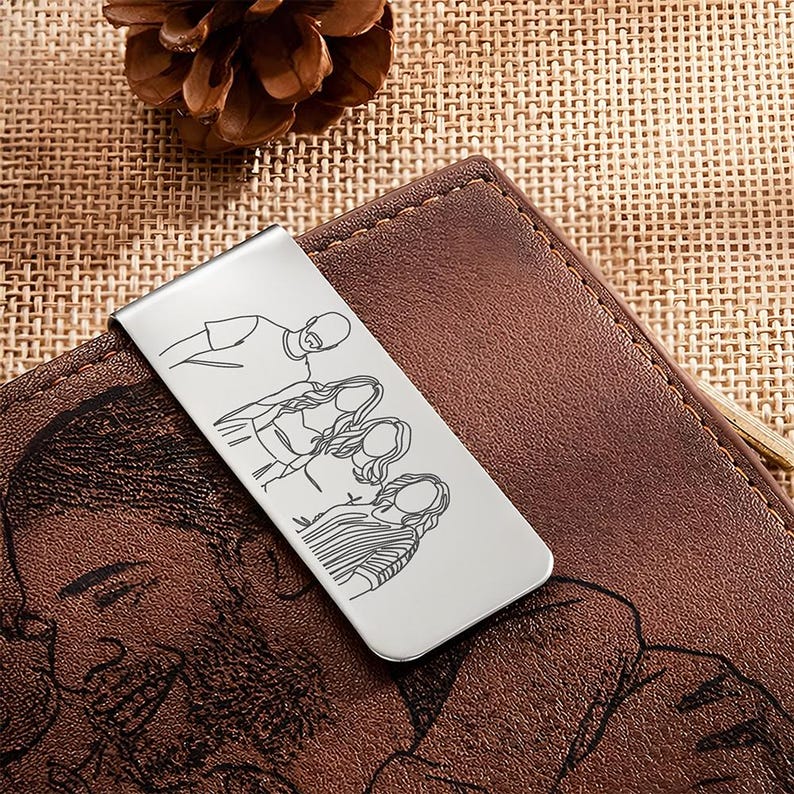 Custom stainless steel money clip engraved with a line art custom portrait, the best photo gift for Father's Day 2026.