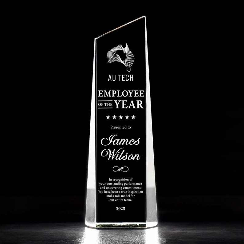 A close-up of an engraved crystal award, the Personalized Long Service Crystal Award is a premium custom corporate gift.