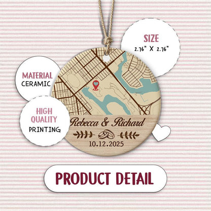 A close-up of a ceramic Christmas tree ornament, the Personalized Map Location Engaged Ceramic Ornament features their special map location.