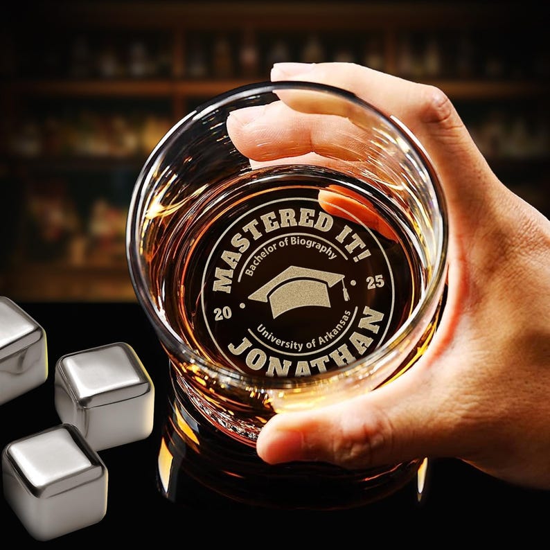 Personalized 'Mastered It' Whiskey Glass for the Class of 2026, a unique and witty masters degree graduation gift.