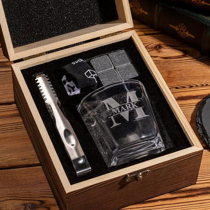 A close-up of a personalized whiskey glass and stone set, the Personalized Monogram Whiskey Set makes a great groomsmen gift.