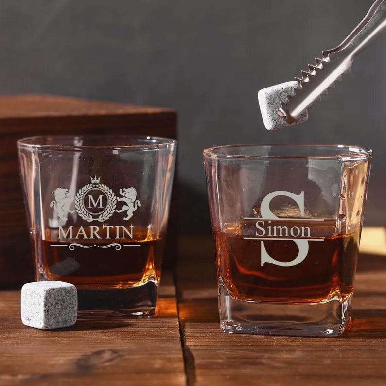 The perfect groomsmen gifts, this Personalized Monogram Whiskey Set is a custom whiskey glass and stone set personalized.