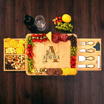 A close-up of a charcuterie board with a beautiful monogram, crafted from sustainable premium bamboo.