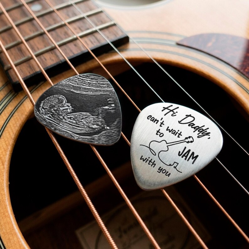 Durable laser engraved guitar pick, providing a professional way to showcase newborn baby memories.