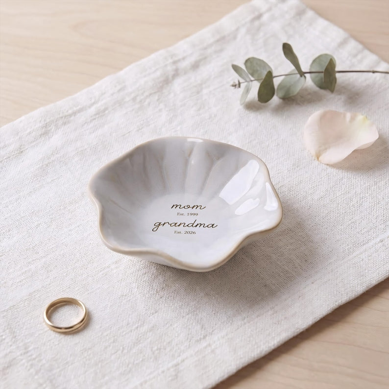 Elegant engraved ring holder for grandma, serving as a lasting memento of a special announcement.