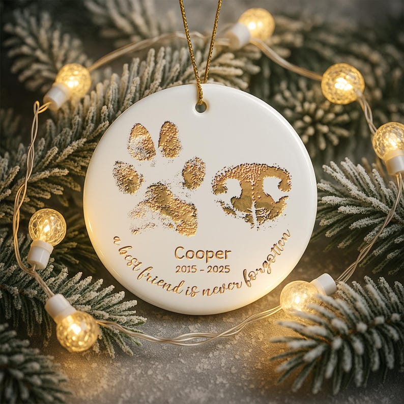 A thoughtful pet loss gift, the Personalized Paw and Nose Ceramic Ornament is a custom dog nose ornament for the holidays.