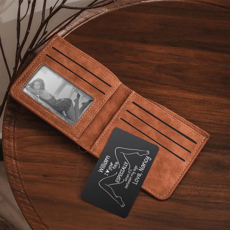A close-up of the Personalized Photo Metal Wallet Card, showing the durable metal and the humorous 'I Love Your Face' engraving.