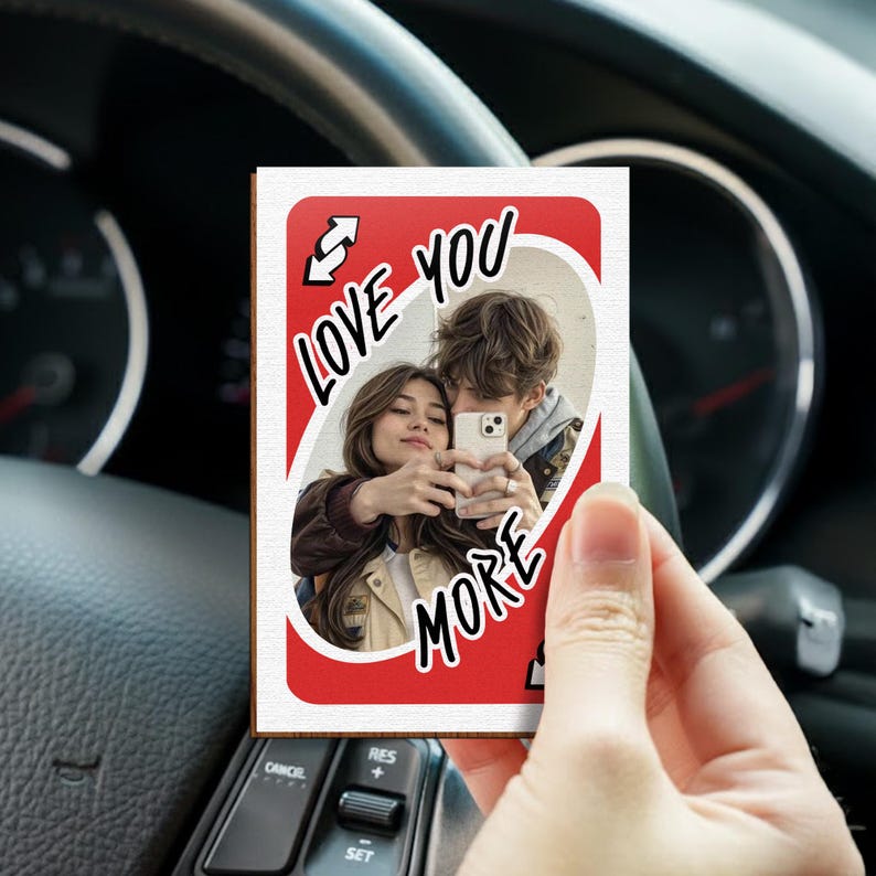 A romantic rear view mirror accessory, this Personalized Love You More Reverse Car Visor Clip is a perfect couple's gift.