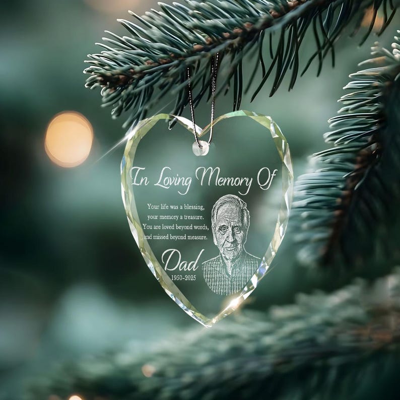 A custom memorial ornament with a picture, the Personalized Photo Memorial Heart Glass Ornament is a beautiful tribute.