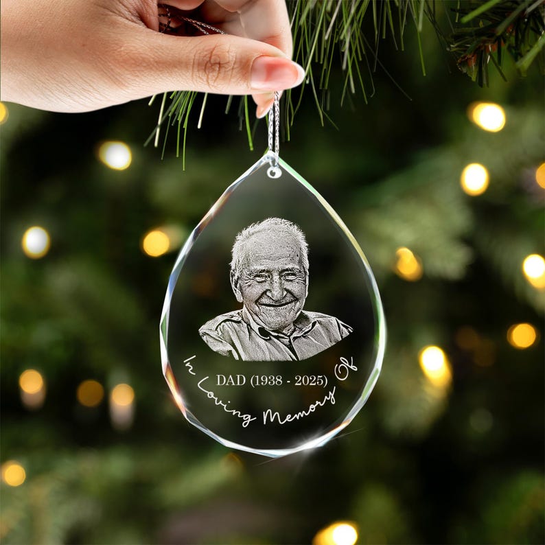 A touching Personalized Photo Memorial Teardrop Glass Ornament, a thoughtful condolence gift to hang on a Christmas tree.